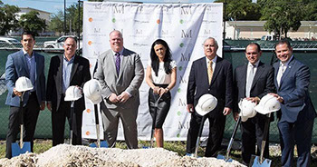 Merrick Manor ceremonial groundbreaking with shovels and construction hard hats.